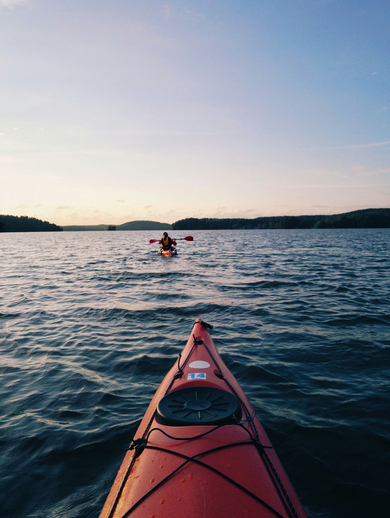 Kayaking on a lake at sunset